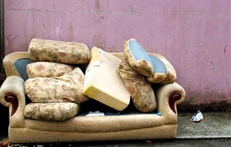 An unwanted sofa awaiting collection