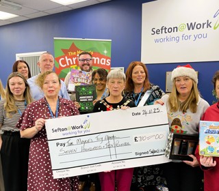 Sefton@Work Manager Linda Patterson and Sefton Mayor Cllr June Burns and members of the Bootle Strand Sefton@Work team 