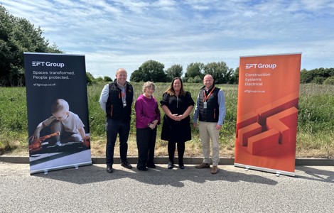 Cllrs Atkinson and Lappin (Centre) with EFT company directors Adam Watts and Stewart Meechan outside scrub land which forms the new site for the EFT team