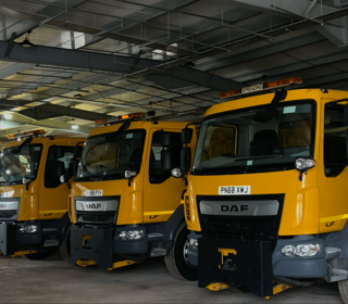 Photo of 5 gritting trucks parked up.