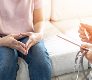 Woman receiving cervical screening consultation