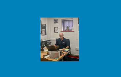 Dave Smith sitting at a desk