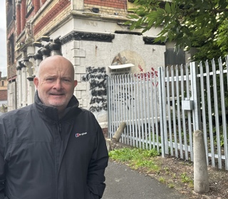 Councillor Peter Harvey, Cabinet Member for Cleansing and Street Scene at site of secure fence. 