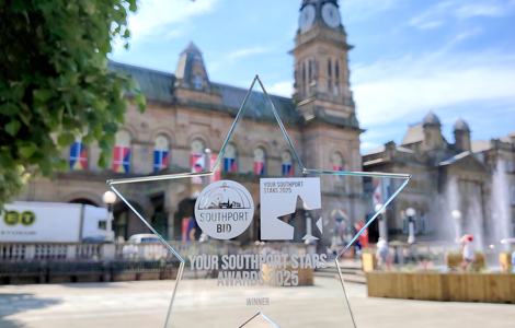 A glass star award called 'Your Southport Stars' in front of the Atkinson in Southport